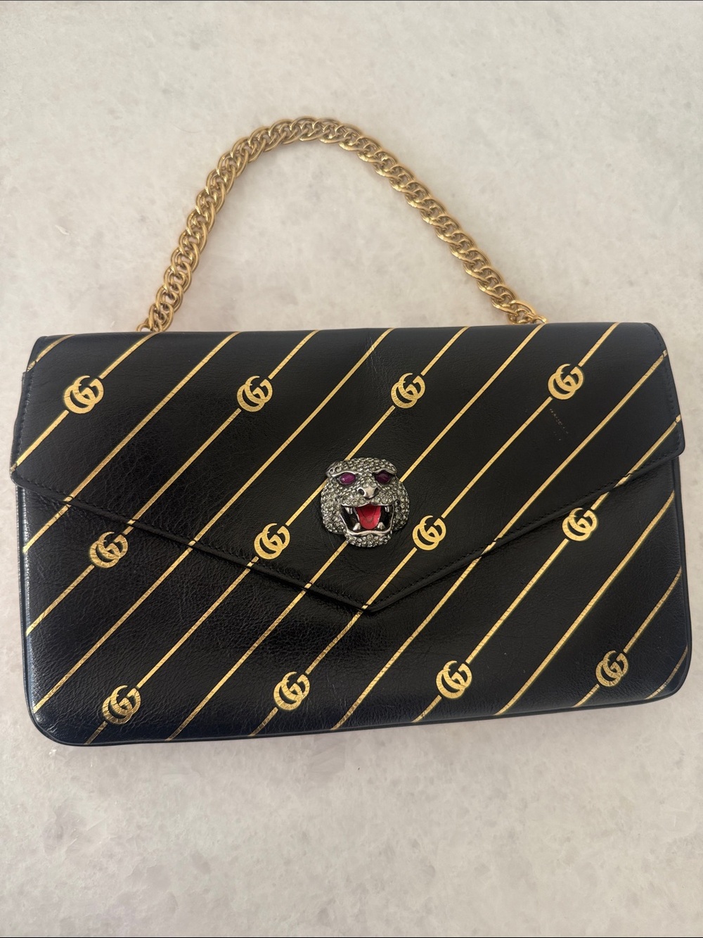 Gucci Black Leather Shoulder Bag with Gold Diagonal GG Stripes and Gold Chain